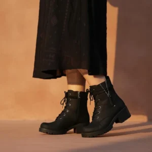 Tan combat boots for women with lace-up fronts, side zippers, low block heels, rubber lug soles, and cushioned memory foam insoles.
