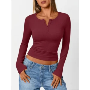 Women’s fitted burgundy henley shirt with long sleeves and button-detail neckline