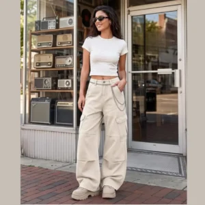 Cargo pants for women with a high-rise waist, wide relaxed legs, and reinforced thigh pockets